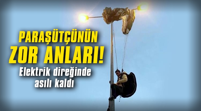 Paraşütçünün zor anları... Elektrik direğinde asılı kaldı