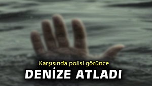 İzmir'de hakkında yakalama kararı bulunan kişi, polis kontrolünde denize atladı