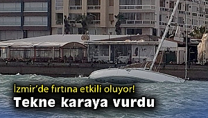 Çeşme'de fırtına nedeniyle yan yatan tekne karaya vurdu