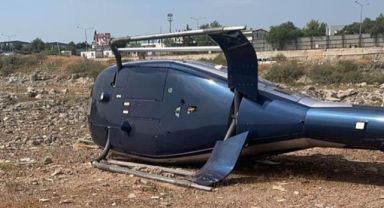 İzmir'in Çiğli ilçesinde sivil bir helikopter kalkış esnasında yan yattı