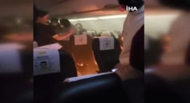 Uçakta taşınabilir şarj cihazı alev aldı, büyük panik yaşandı