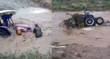 Sele kapılan traktörü kurtarmak isterken az daha canından oluyordu