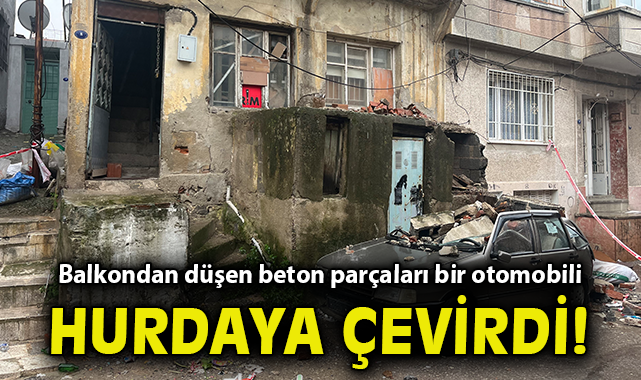 Eski binanın balkonundan düşen beton parçaları bir otomobili kullanılamayacak hale getirdi